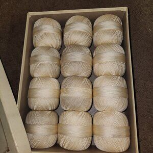 Vintage box with 12 balls of crochet cotton